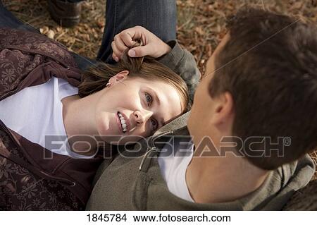 Couple relaxing together View Large Photo Image Picture - Couple relaxing together. Fotosearch