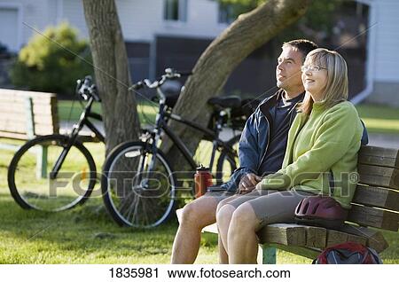 Stock Image - Couple sitting together. Fotosearch