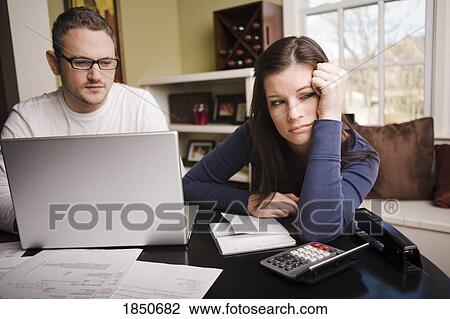 Stock Image - Couple with financial stress. Fotosearch