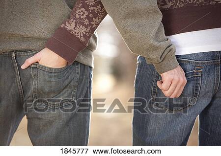 Couple with hands in each others back pockets View Large Photo Image Stock Photo - Couple with hands in each others back pockets. Fotosearch