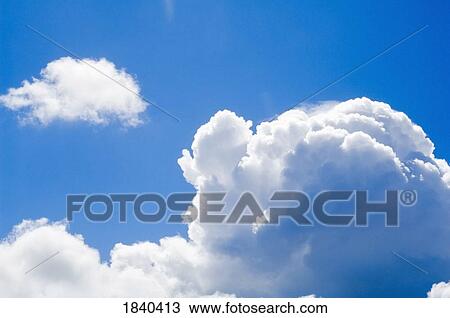 Stock Image - Cumulus clouds and blue sky. Fotosearch