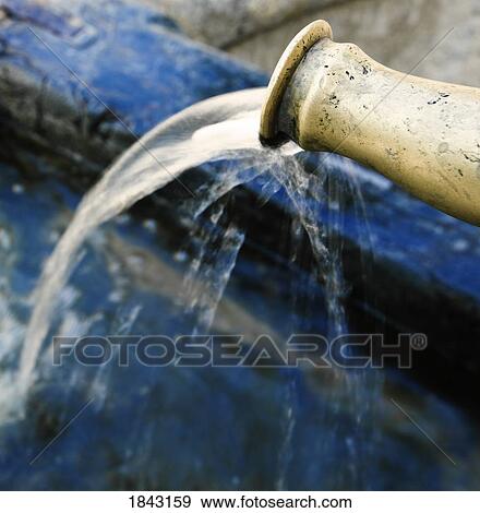 Stock Photo - Córdoba (Cordova), Spain; Water spout of an ancient fountain. Fotosearch