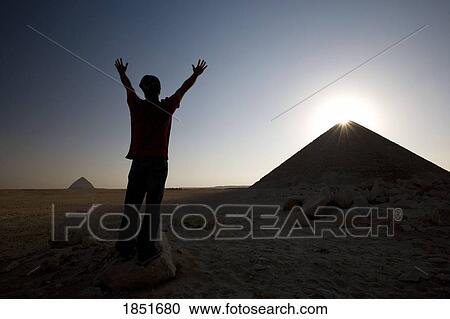 Dahshur, Egypt; Man with arms raised in front of the Red Pyramid View Large Photo Image Stock Image - Dahshur, Egypt; Man with arms raised in front of the Red Pyramid. Fotosearch