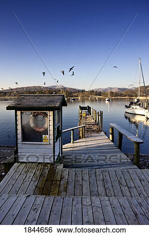 Dock in a lake harbor, Cumbria, England View Large Photo Image Stock Photograph - Dock in a lake harbor, Cumbria, England. Fotosearch
