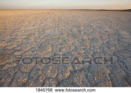 Stock Photo - Dry ground reaching into the horizon. Fotosearch
