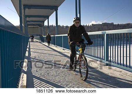 Edmonton, Alberta, Canada; People on a walking bridge View Large Photo Image Stock Photograph - Edmonton, Alberta, Canada; People on a walking bridge. Fotosearch