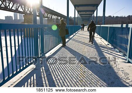 Edmonton, Alberta, Canada; People on a walking bridge View Large Photo Image Stock Photography - Edmonton, Alberta, Canada; People on a walking bridge. Fotosearch