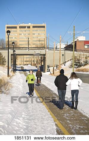 Stock Image - Edmonton, Alberta, Canada; People on the walking paths. Fotosearch