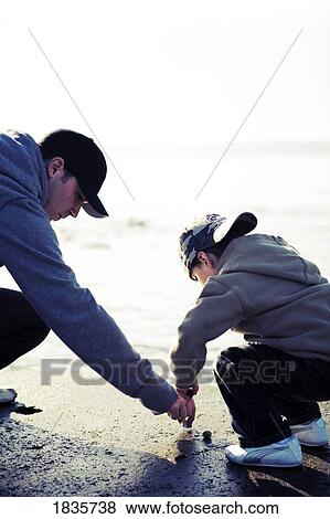 Exploring at the beach View Large Photo Image Stock Photo - Exploring at the beach. Fotosearch
