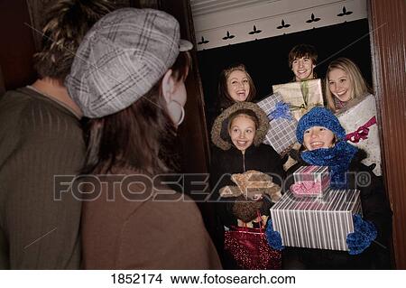 Family bringing gifts View Large Photo Image Picture - Family bringing gifts. Fotosearch