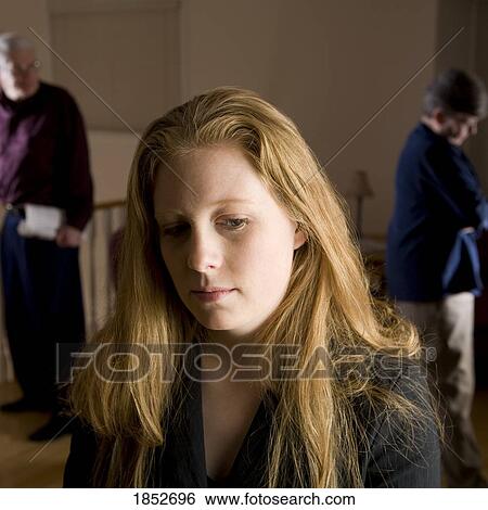 Family fight; Sad girl with parents fighting in background View Large Photo Image Stock Photograph - Family fight; Sad girl with parents fighting in background. Fotosearch