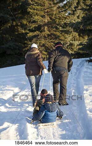 Picture - Family walking in the snow. Fotosearch