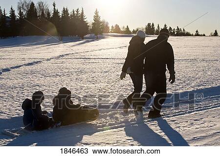 Family walking in the snow View Large Photo Image Stock Image - Family walking in the snow. Fotosearch
