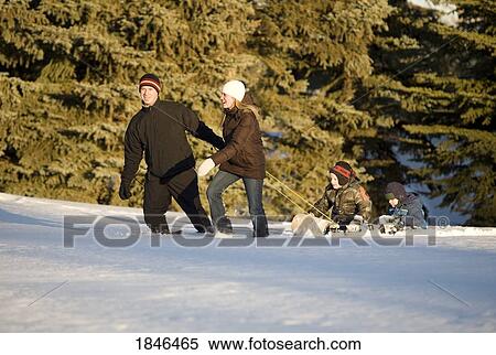 Family walking in the snow View Large Photo Image Stock Photography - Family walking in the snow. Fotosearch