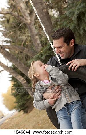 Father and daughter playing together View Large Photo Image Picture - Father and daughter playing together. Fotosearch