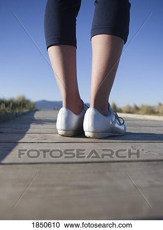 Stock Image - Feet on the ground. Fotosearch