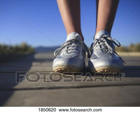 Stock Image - Feet on the ground. Fotosearch