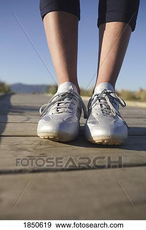 Stock Photo - Feet on the ground. Fotosearch