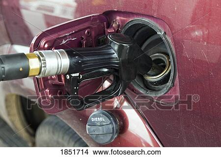Filling tank of vehicle with fuel View Large Photo Image Picture - Filling tank of vehicle with fuel . Fotosearch