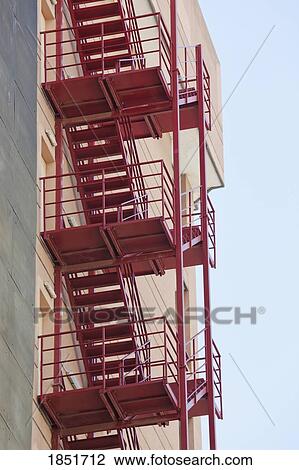 Stock Image - Fire escape on side of apartment building . Fotosearch