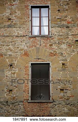 Florence, Italy; Windows on a brick building View Large Photo Image Stock Image - Florence, Italy; Windows on a brick building. Fotosearch