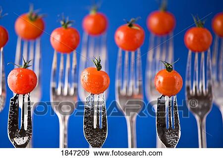 Stock Photo - Forks with cherry tomatoes. Fotosearch