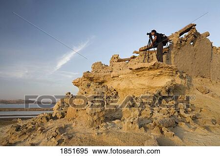 Stock Photography - Fortress of Shali, Siwa Oasis, Egypt; Tourist taking photographs. Fotosearch