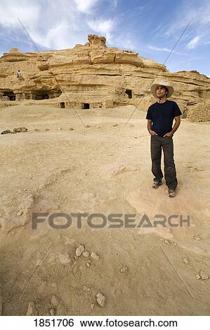 Stock Photograph - Fortress of Shali, Siwa Town, Siwa Oasis, Egypt, Africa; A tourist enjoying the view. Fotosearch