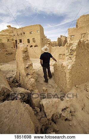 Fortress of Shali, Swiss Oasis, Egypt, Africa; A tourist exploring the area View Large Photo Image Stock Photo - Fortress of Shali, Swiss Oasis, Egypt, Africa; A tourist exploring the area. Fotosearch