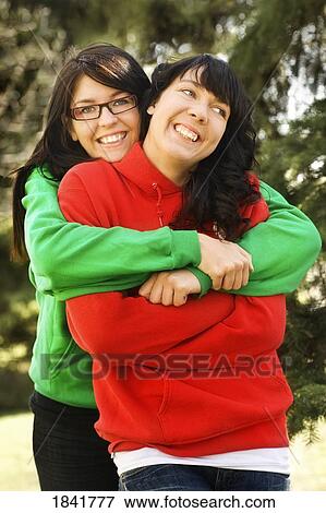 Friends hugging View Large Photo Image Stock Photo - Friends hugging. Fotosearch