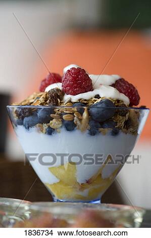 Fruit and granola in yogurt View Large Photo Image Picture - Fruit and granola in yogurt. Fotosearch