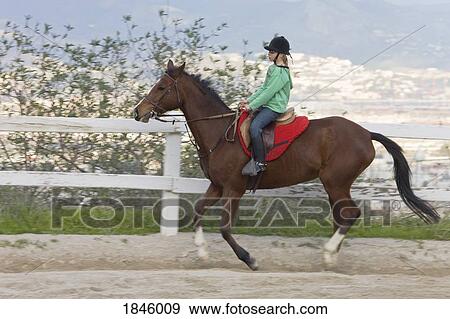 Stock Photo - Girl horseback riding. Fotosearch