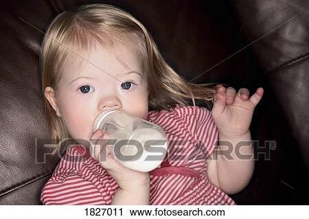 Stock Image - Girl with a bottle. Fotosearch