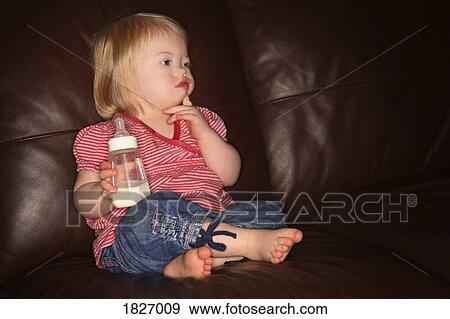 Stock Photo - Girl with a bottle. Fotosearch