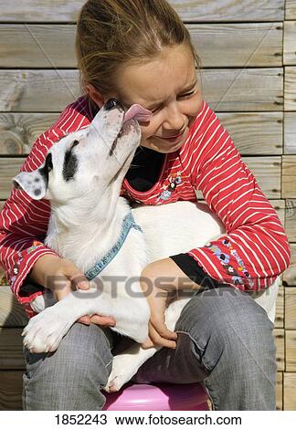 Stock Image - Girl with dog; Portrait of a girl with a dog. Fotosearch