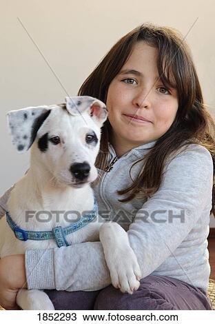 Stock Image - Girl with dog. Fotosearch