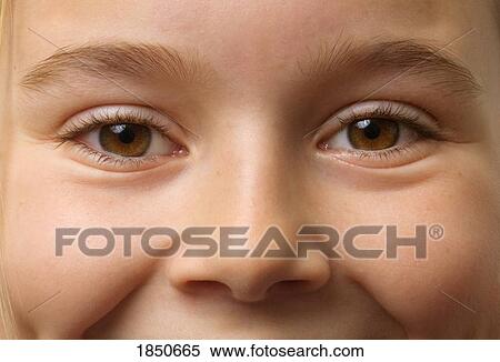 Stock Photography - Girl's face; Child with brown eyes. Fotosearch