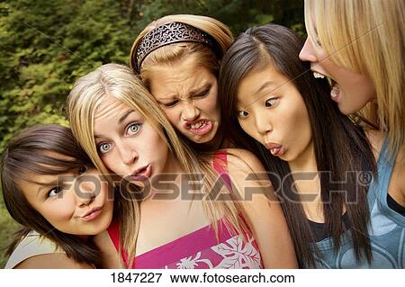 Stock Photo - Group of girls; Girls making silly faces. Fotosearch