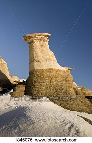 Hoodoos in winter, Drumheller, Alberta, Canada View Large Photo Image Stock Photograph - Hoodoos in winter, Drumheller, Alberta, Canada. Fotosearch