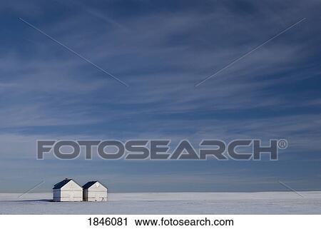 Hussar, Alberta, Canada; Two small farm buildings in flat winter landscape View Large Photo Image Stock Image - Hussar, Alberta, Canada; Two small farm buildings in flat winter landscape . Fotosearch