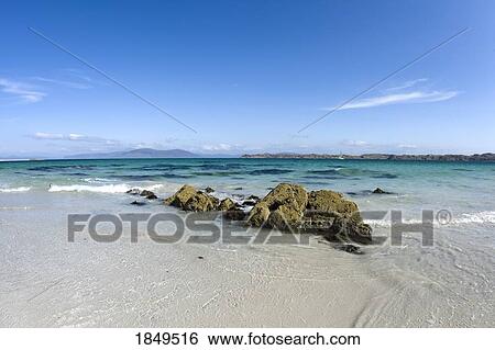 Stock Photograph - Iona, Scotland; Rocks close to shore. Fotosearch