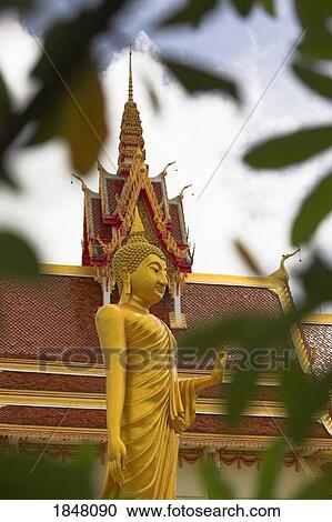 Stock Image - Isan, Thailand; Buddha and temple . Fotosearch