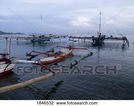 Stock Image - Java sea, Bali, Indonesia; Balinese fishing vessels. Fotosearch