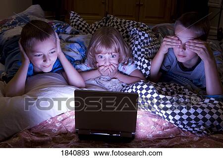 Kids watching scary movie View Large Photo Image Stock Image - Kids watching scary movie. Fotosearch