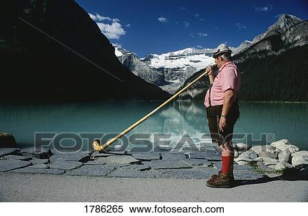 Lake Louise, Banff National Park, Banff, Alberta, Canada; Man playing Alpine Horn View Large Photo Image Stock Photography - Lake Louise, Banff National Park, Banff, Alberta, Canada; Man playing Alpine Horn. Fotosearch