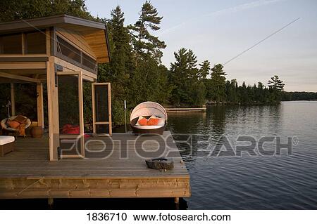 Lake of the Woods, Ontario, Canada; Lounge chairs on dock View Large Photo Image Stock Image - Lake of the Woods, Ontario, Canada; Lounge chairs on dock. Fotosearch
