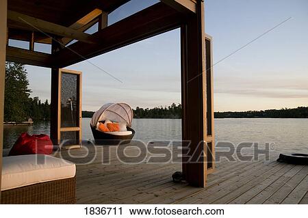 Lake of the Woods, Ontario, Canada; Lounge chairs on dock View Large Photo Image Stock Image - Lake of the Woods, Ontario, Canada; Lounge chairs on dock. Fotosearch