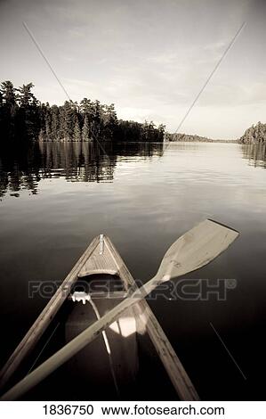 Stock Image - Lake of the Woods, Ontario, Canada; Boat on the water. Fotosearch