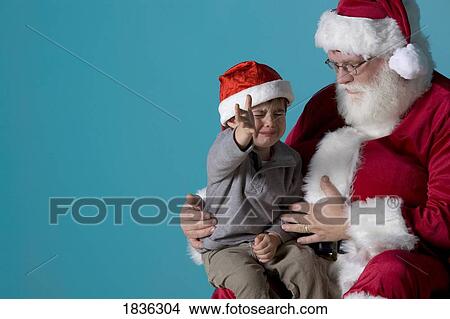 Little boy crying on Santa's lap View Large Photo Image Picture - Little boy crying on Santa's lap. Fotosearch