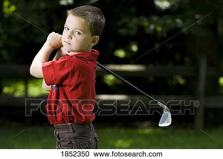 Little golfer; Young boy with a golf club View Large Photo Image Stock Image - Little golfer; Young boy with a golf club. Fotosearch